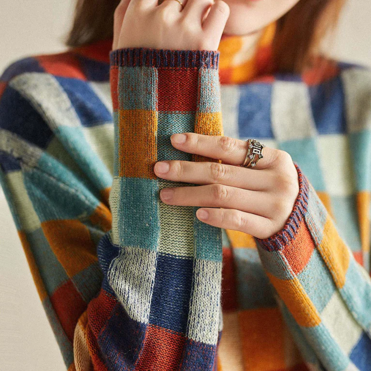 Wanda | Colorful turtleneck sweater with patchwork knit pattern