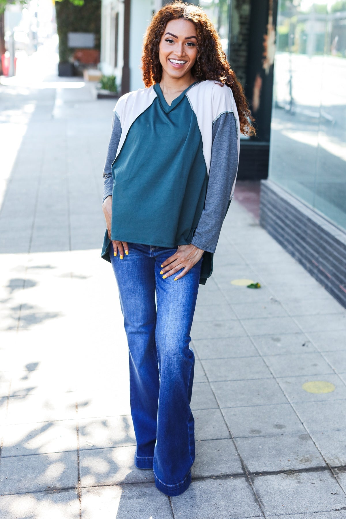 Beate | Standout hunter green raglan top with color block outseam and V-neckline
