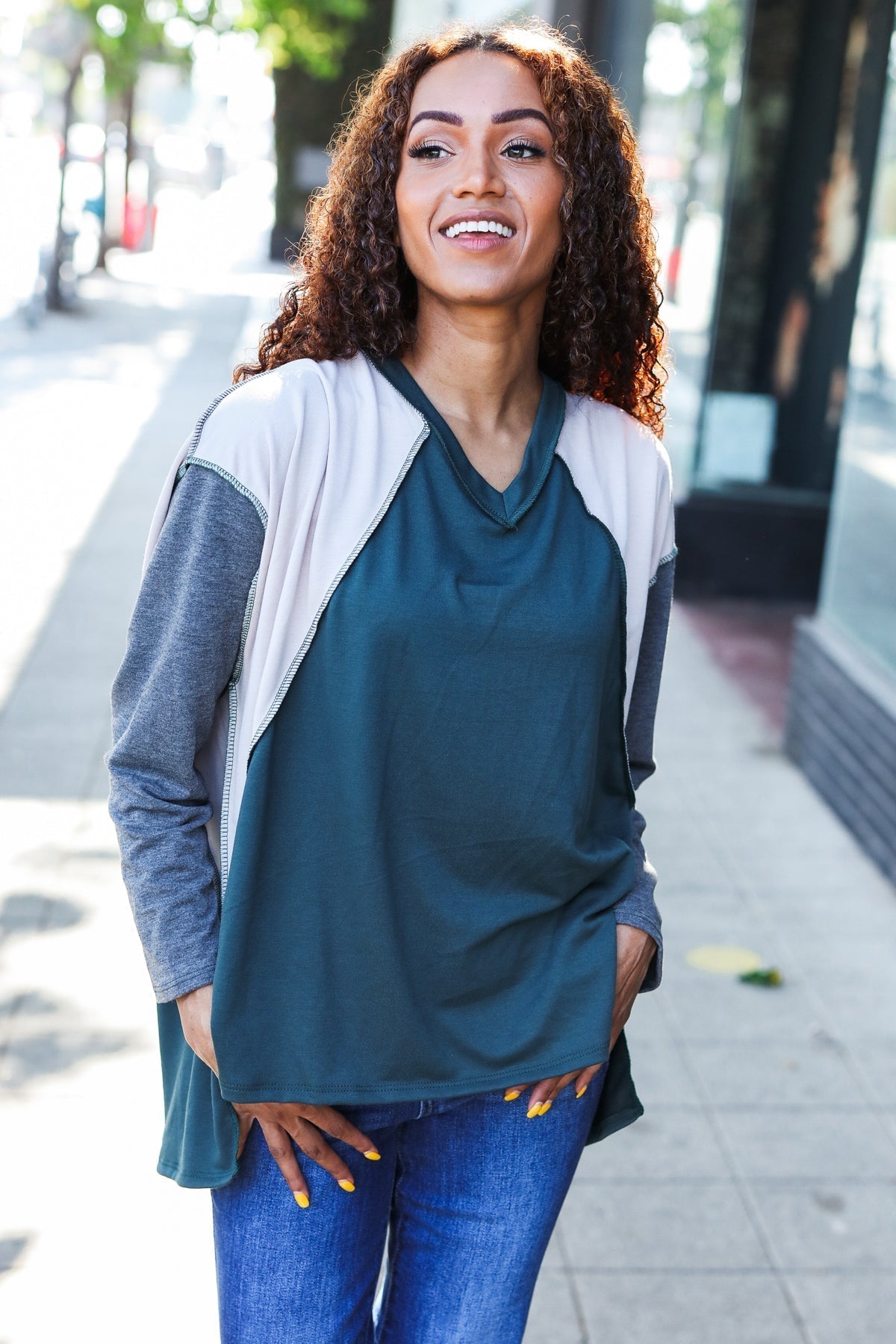 Beate | Standout hunter green raglan top with color block outseam and V-neckline
