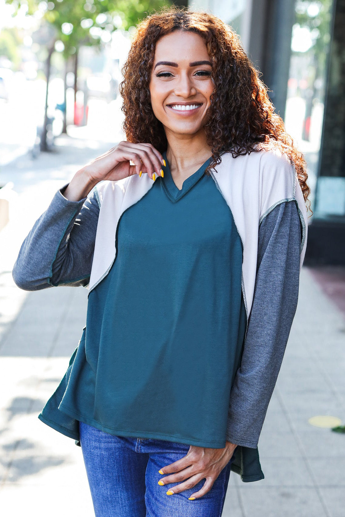 Beate | Standout hunter green raglan top with color block outseam and V-neckline