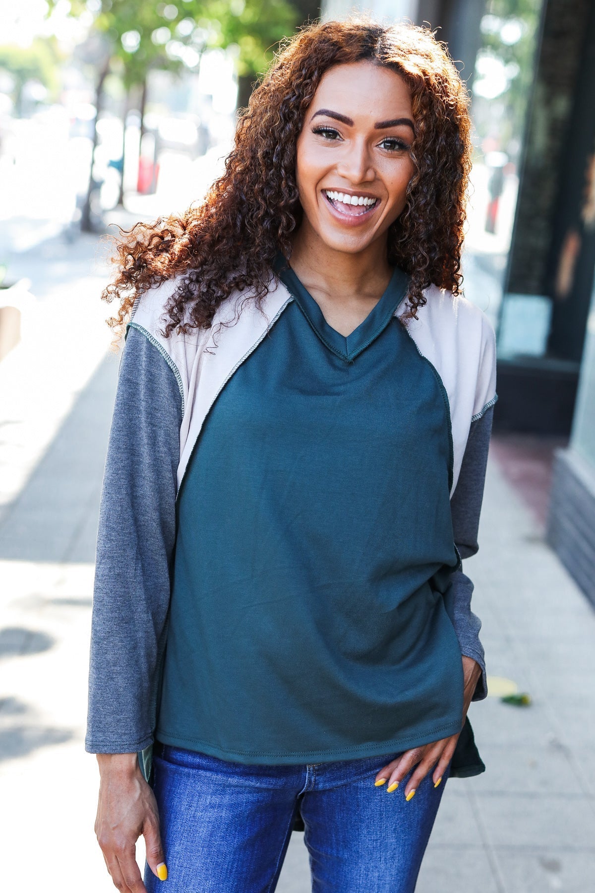 Beate | Standout hunter green raglan top with color block outseam and V-neckline