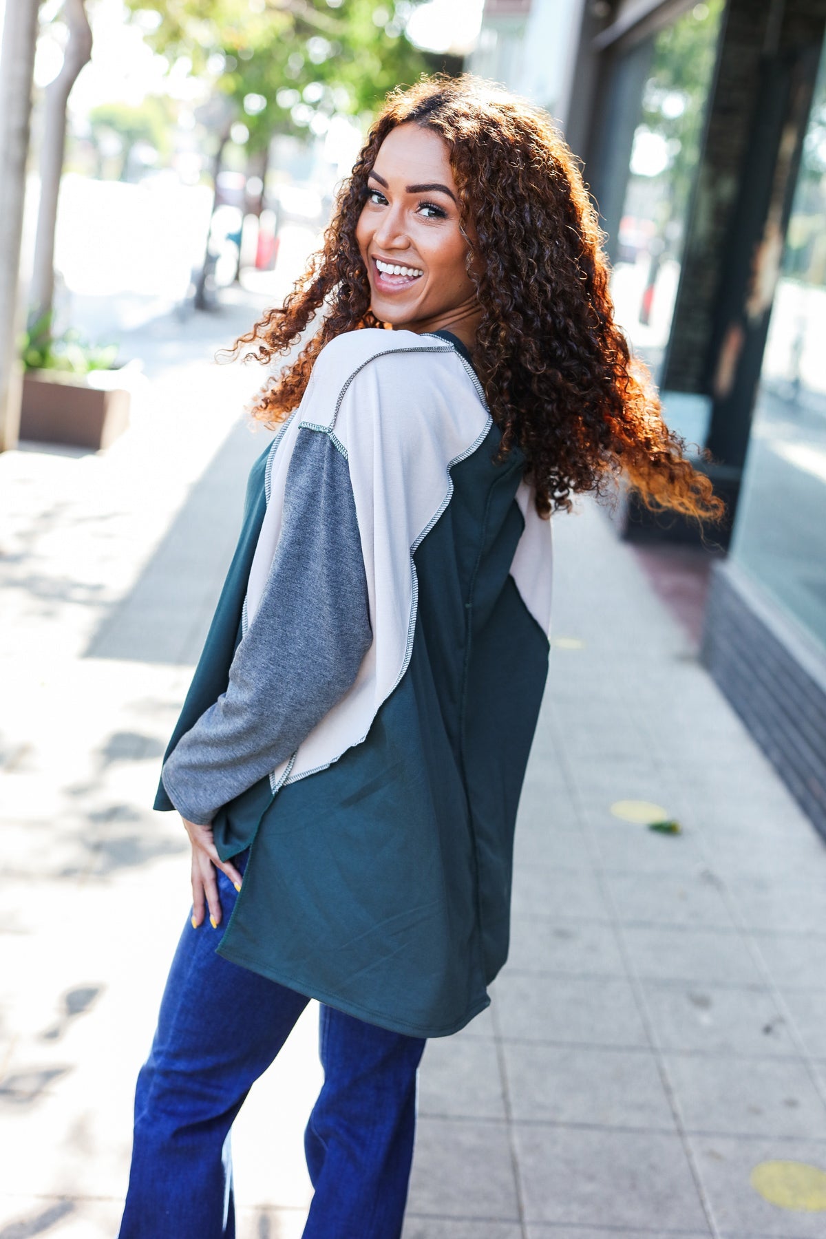 Beate | Standout hunter green raglan top with color block outseam and V-neckline