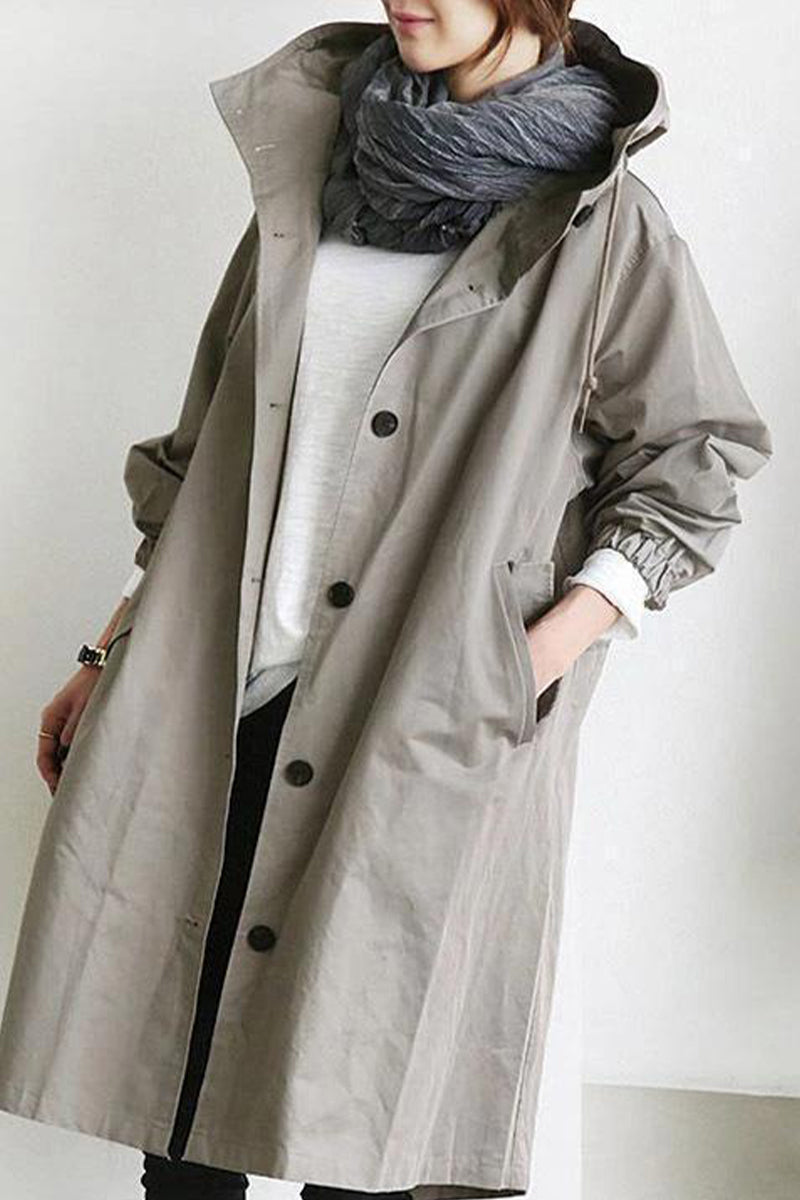 Marcia | British style, solid outerwear with pocket buttons and hooded collar