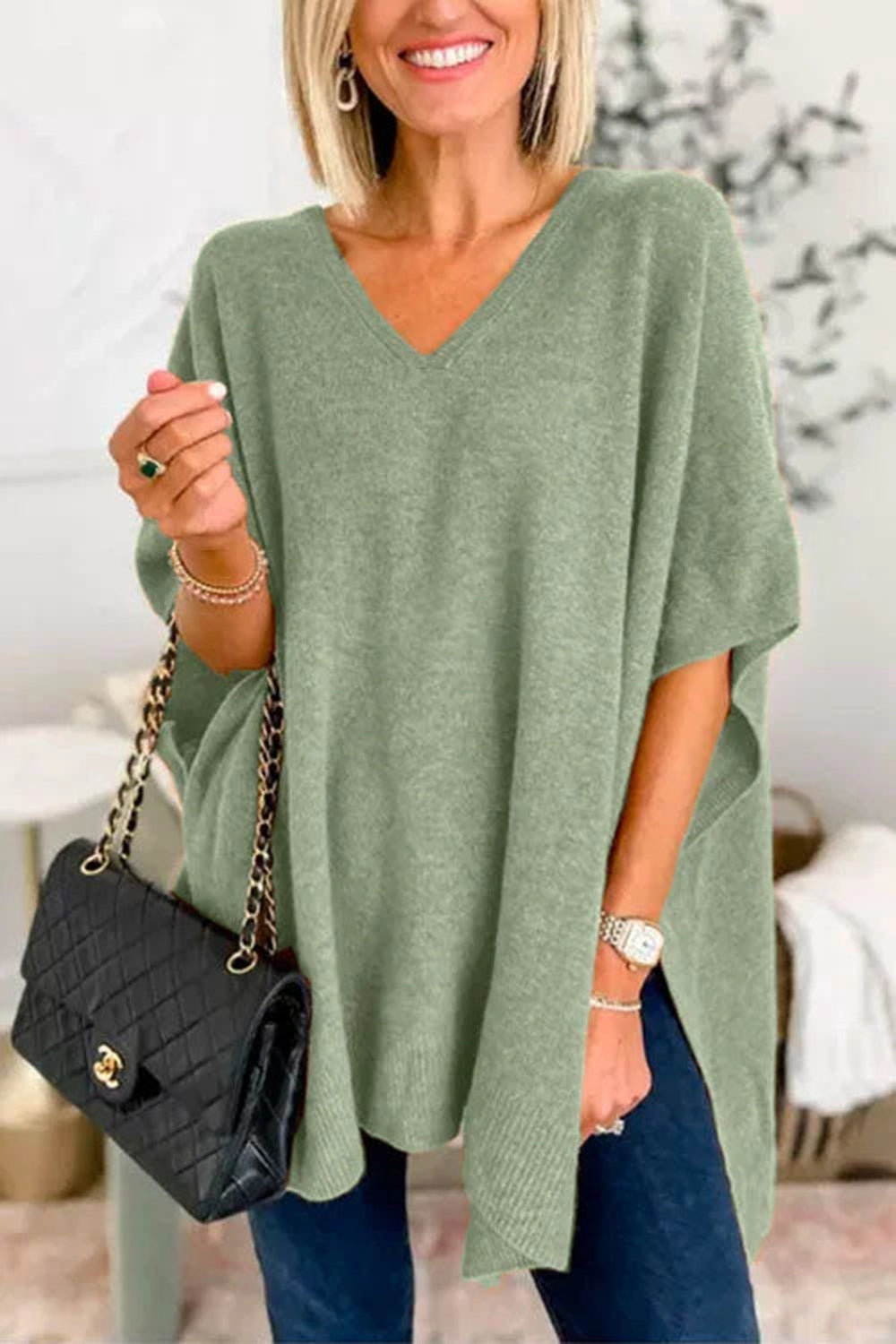 Erika | Slit knit top with V-neck and half sleeves