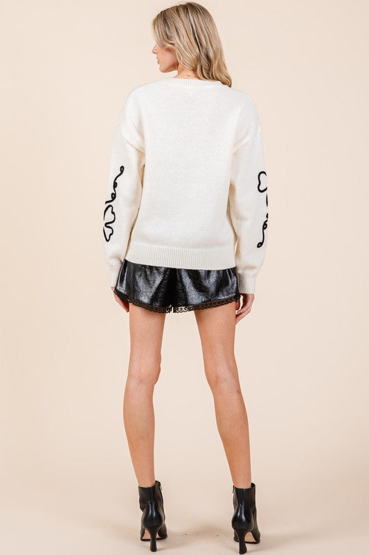 Adriana | Knitted sweater with floral embroidery
