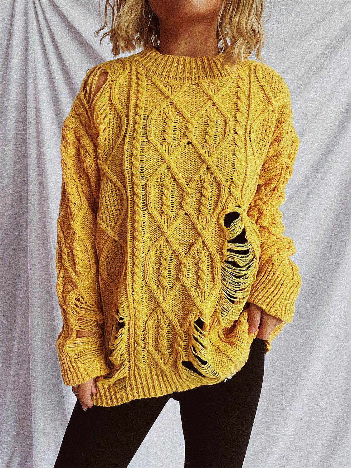 Clara | Long-sleeved, crew-neck, distressed cable-knit sweater