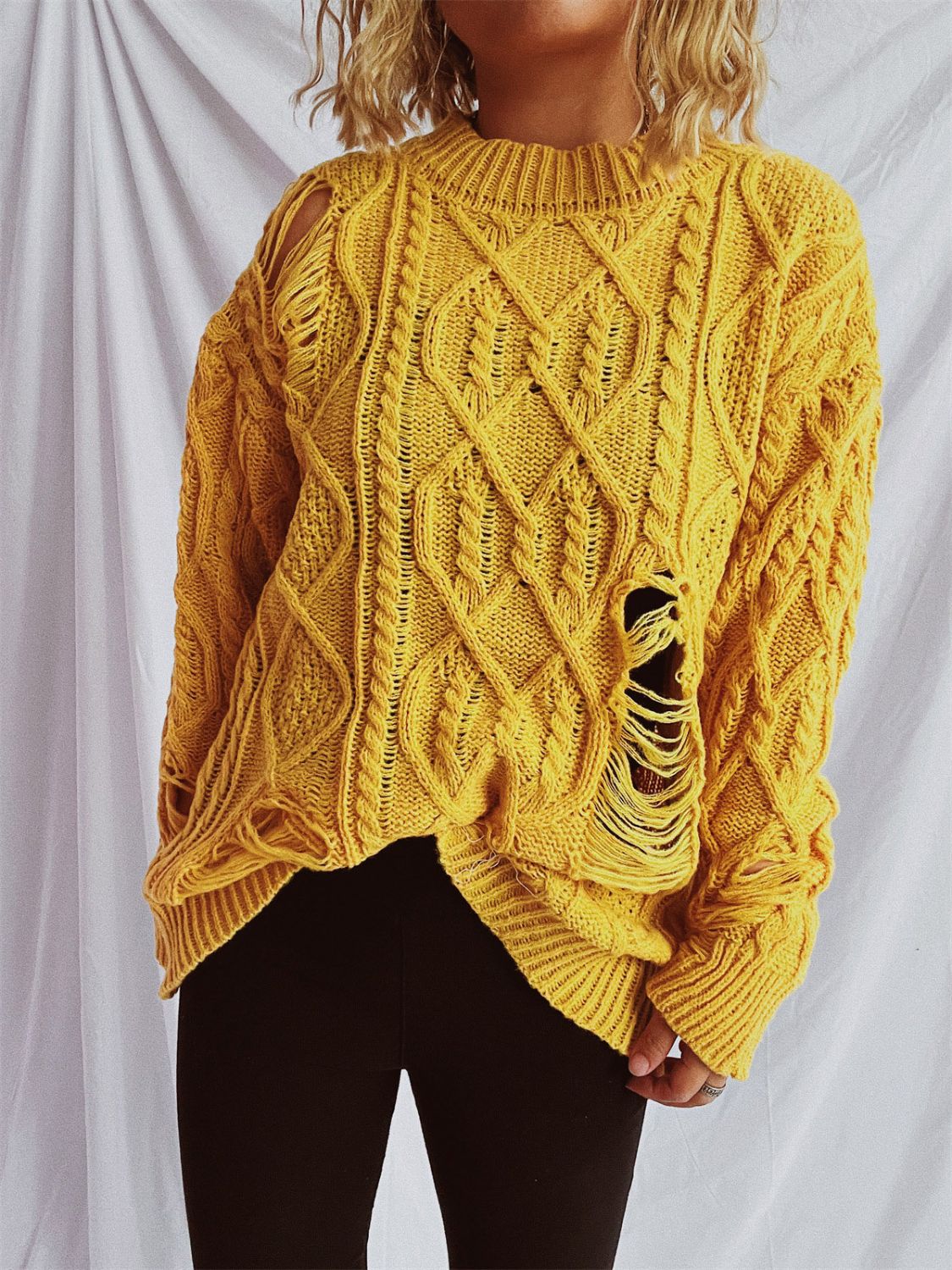 Clara | Long-sleeved, crew-neck, distressed cable-knit sweater