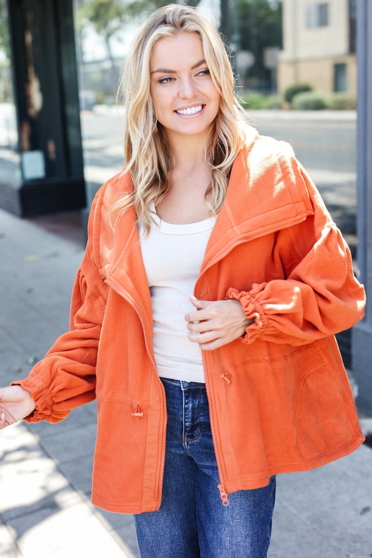 Xaviera | Beautiful You Rust fleece jacket with a fitted waist and zip fastening