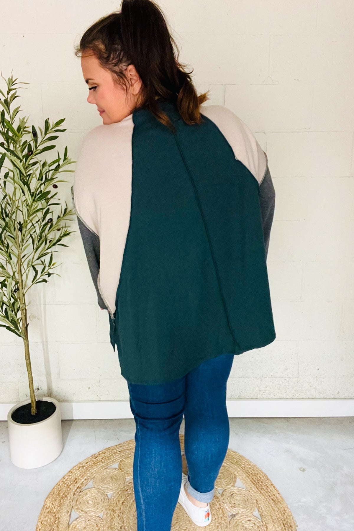 Beate | Standout hunter green raglan top with color block outseam and V-neckline