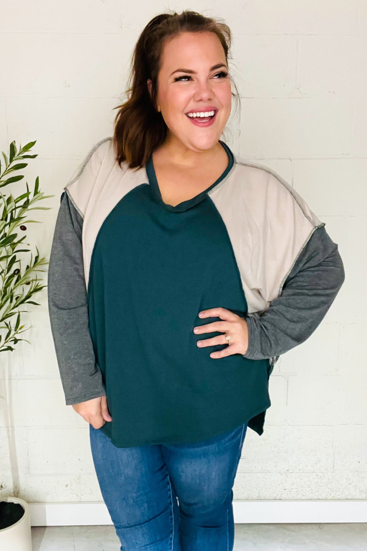 Beate | Standout hunter green raglan top with color block outseam and V-neckline