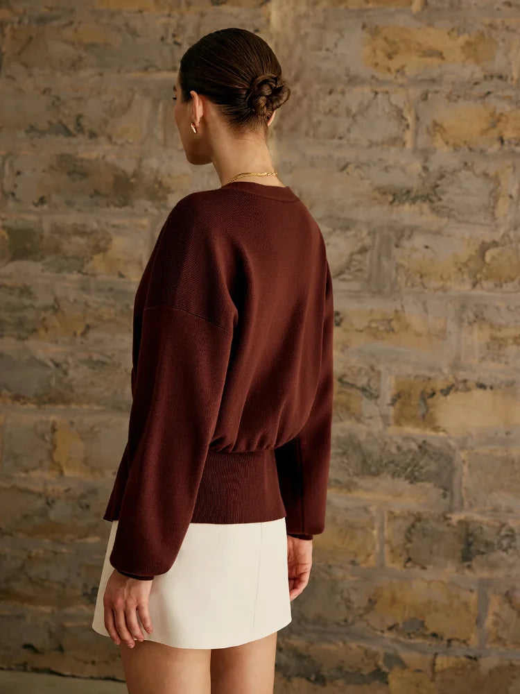 Brigida | Stylish women's knitted sweater with a button placket in a solid color
